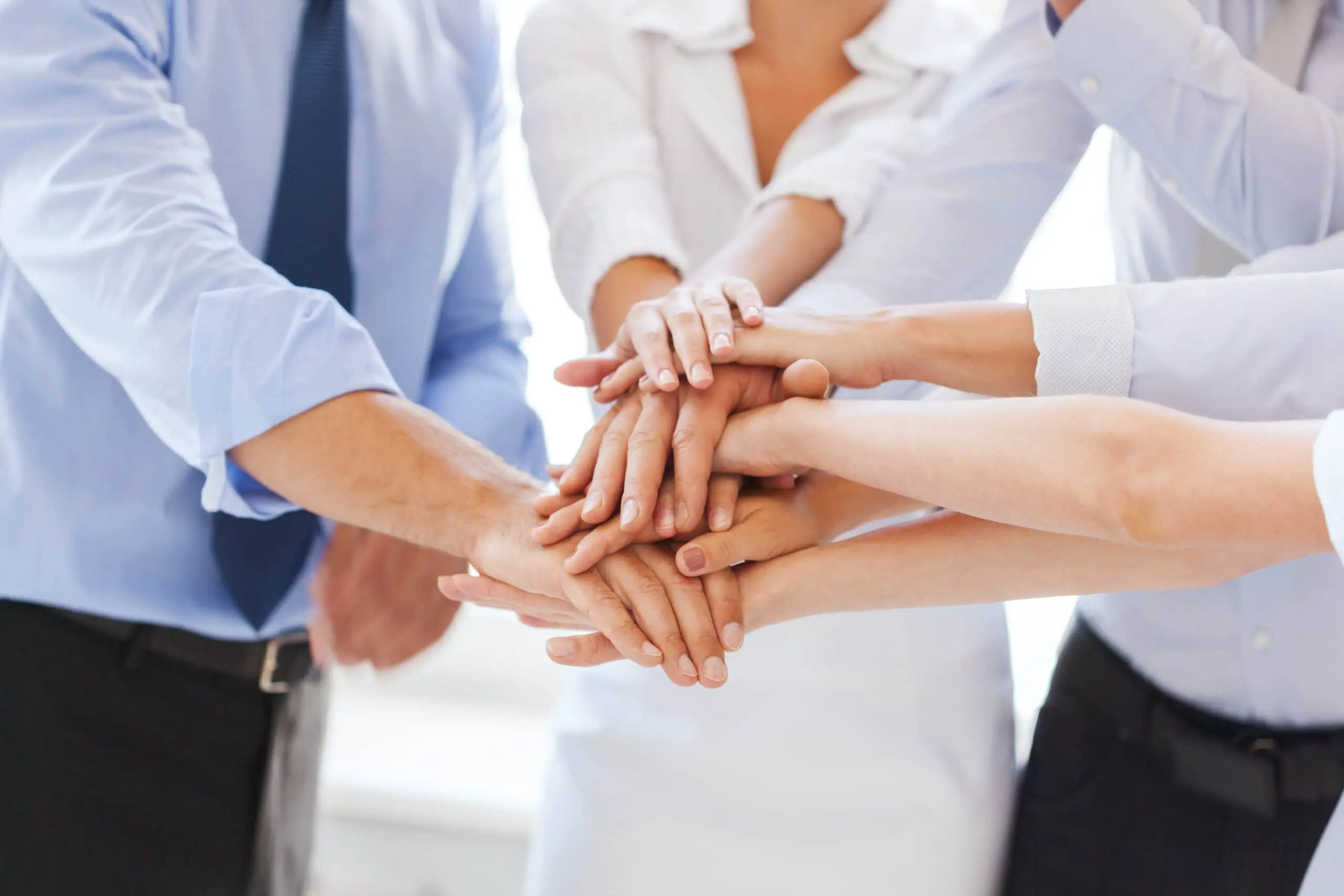 business team celebrating victory in office
